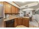 Well-equipped kitchen featuring wood cabinets and granite countertops at 455 S Delaware Dr # 1, Apache Junction, AZ 85120