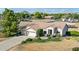 Aerial view of a home with a large lot, mountain views, and separate horse stables at 25350 W Riverside St, Buckeye, AZ 85326