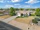 Single-story home with a two-car garage and landscaped front yard at 25350 W Riverside St, Buckeye, AZ 85326