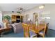 Open dining area with a view into the kitchen and living room at 25350 W Riverside St, Buckeye, AZ 85326