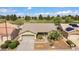 Aerial view of single-story house with desert landscaping and golf course at 17826 N Encanto Dr, Surprise, AZ 85374