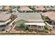 Single story home with a covered patio and a landscaped backyard at 17826 N Encanto Dr, Surprise, AZ 85374