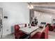 Bright dining area with a retro-style booth and view into the living room at 8643 E San Jacinto Dr, Scottsdale, AZ 85258