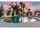 Relaxing kidney-shaped pool with fountains and lush landscaping at 8643 E San Jacinto Dr, Scottsdale, AZ 85258