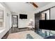 Home office with a glass desk and a comfortable armchair at 8643 E San Jacinto Dr, Scottsdale, AZ 85258