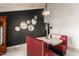Retro-style dining area with red vinyl booths and a unique gear wall decor at 8643 E San Jacinto Dr, Scottsdale, AZ 85258