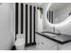 Clean and modern bathroom with a dark countertop and hexagon tile floor at 8643 E San Jacinto Dr, Scottsdale, AZ 85258