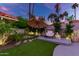 Relaxing backyard patio with seating area and checkerboard-patterned walkway at 8643 E San Jacinto Dr, Scottsdale, AZ 85258