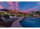 Kidney shaped pool with a large surrounding patio at 8643 E San Jacinto Dr, Scottsdale, AZ 85258