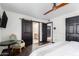 Comfortable bedroom with a seating area and dark hardwood floors at 8643 E San Jacinto Dr, Scottsdale, AZ 85258