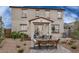 Relaxing backyard with patio furniture and built-in grill at 36433 W San Ildefanso Ave, Maricopa, AZ 85138