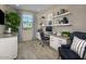 Bright home office with built-in shelving and granite countertops at 36433 W San Ildefanso Ave, Maricopa, AZ 85138