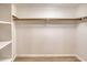 Large walk-in closet with double hanging rods and shelving at 2511 Leisure World --, Mesa, AZ 85206