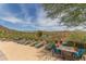 Pool area with lounge chairs and mountain views at 41245 N Rolling Green Way, Anthem, AZ 85086