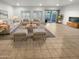 Spacious living room with tile floors and access to backyard at 10826 W Bronco Trl, Peoria, AZ 85383