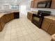 Kitchen features modern appliances and wood cabinets at 10826 W Bronco Trl, Peoria, AZ 85383