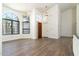 Dining room with hardwood floors and arched windows at 13234 S 35Th Ct, Phoenix, AZ 85044