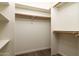 Large walk-in closet with double hanging rods and shelving at 13234 S 35Th Ct, Phoenix, AZ 85044