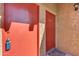 Condo entry with two red doors and keyless entry at 5525 E Thomas Rd # F9, Phoenix, AZ 85018
