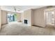 Bright living room with fireplace and access to patio at 5525 E Thomas Rd # F9, Phoenix, AZ 85018