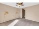 Bright bedroom featuring wall sconces and ceiling fan at 5525 E Thomas Rd # F9, Phoenix, AZ 85018