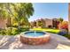 Community courtyard with a central fountain and lush landscaping at 5525 E Thomas Rd # F9, Phoenix, AZ 85018