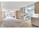 Open living area with kitchen and access to patio at 5525 E Thomas Rd # F9, Phoenix, AZ 85018