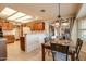 Bright kitchen with breakfast nook and view to backyard at 20439 N 135Th Ave, Sun City West, AZ 85375