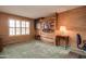 Home office with built-in wooden wall unit and window at 20439 N 135Th Ave, Sun City West, AZ 85375