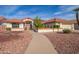 Single-story home with terracotta tile roof, landscaped yard, and paved walkway at 20439 N 135Th Ave, Sun City West, AZ 85375