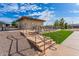 Park restrooms and picnic tables with adjacent grassy area at 11526 E Milagro Ave, Mesa, AZ 85209