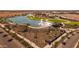 Aerial view of a community lake with fountains and surrounding park at 1252 W J Waltz Way, Apache Junction, AZ 85120