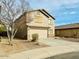 Two-story house with attached garage and desert landscaping at 42802 W Hillman Dr, Maricopa, AZ 85138