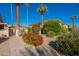 Building exterior showcasing a well-maintained landscape at 4848 N Woodmere Fairway -- # 15, Scottsdale, AZ 85251