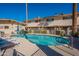 Relaxing kidney-shaped pool with lounge chairs at 4848 N Woodmere Fairway -- # 15, Scottsdale, AZ 85251