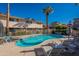 Inviting kidney-shaped pool with surrounding patio furniture at 4848 N Woodmere Fairway -- # 15, Scottsdale, AZ 85251