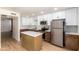 Updated kitchen featuring an island and stainless steel appliances at 4848 N Woodmere Fairway -- # 15, Scottsdale, AZ 85251