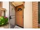Condo entrance with security gate and landscaping at 4848 N Woodmere Fairway -- # 15, Scottsdale, AZ 85251