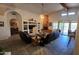 Living room with a fireplace, built-in shelving, and large windows at 2926 W Tanya Trl, Phoenix, AZ 85086