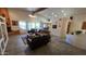 Spacious living room with a high ceiling, tiled floors, and leather furniture at 2926 W Tanya Trl, Phoenix, AZ 85086
