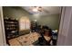 Home office features built-in shelving, window with shutters and exercise bike at 2926 W Tanya Trl, Phoenix, AZ 85086