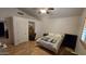 Spacious bedroom with wood flooring, ceiling fan, and ample closet space at 2926 W Tanya Trl, Phoenix, AZ 85086