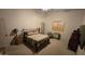 Cozy bedroom with a striped comforter and wooden nightstand at 2926 W Tanya Trl, Phoenix, AZ 85086
