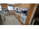 Kitchen features wood cabinets, stainless steel appliances, and tile floors at 2926 W Tanya Trl, Phoenix, AZ 85086