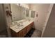 Double vanity bathroom with wood cabinets and large mirror at 2926 W Tanya Trl, Phoenix, AZ 85086