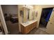 Bathroom with double vanity, large mirror, and access to bedroom at 2926 W Tanya Trl, Phoenix, AZ 85086