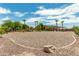 Spacious backyard with gravel landscaping and palm trees at 11305 S 195Th Dr, Buckeye, AZ 85326