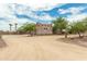 Three-car garage with stucco exterior and large driveway at 11305 S 195Th Dr, Buckeye, AZ 85326