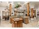 Spacious kitchen with island, wood cabinets, and granite countertops at 11305 S 195Th Dr, Buckeye, AZ 85326