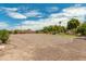 Large gravel backyard area with mature trees at 11305 S 195Th Dr, Buckeye, AZ 85326